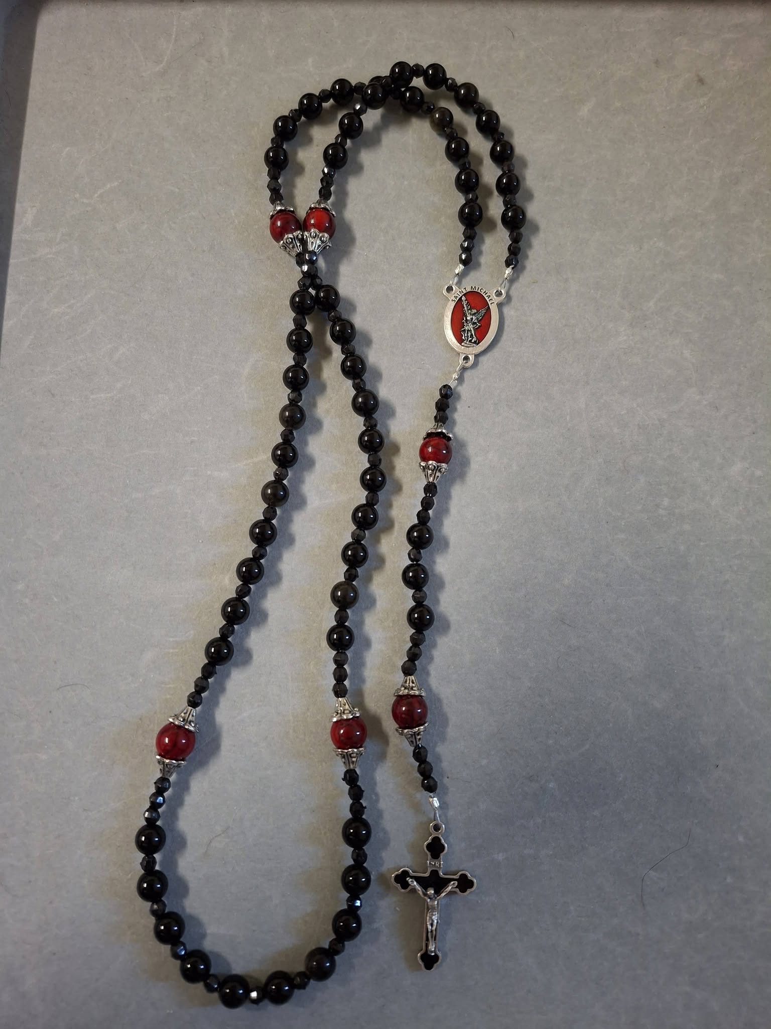 Red and Black Rosary with Saint Michael Centerpiece